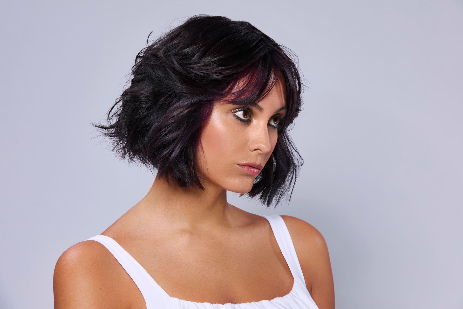 Choppy short bob with purple highlights